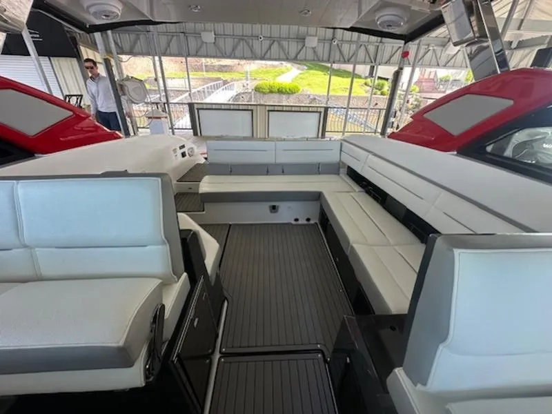 Slide: The Image of Interior of 2022 Cobalt A36BR boat with white seating and modern design. - 29