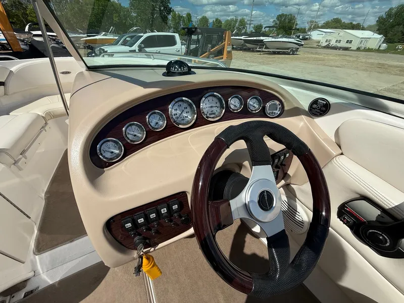 Slide: The Image of Interior dashboard of a 2000 Chaparral 196 SSi boat with gauges and steering wheel. - 17