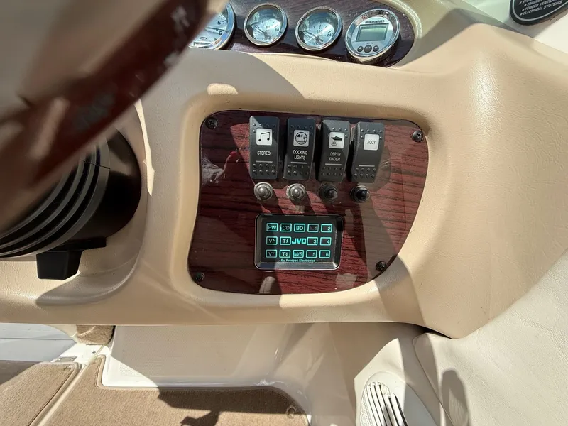 Slide: The Image of Control panel of a 2000 Chaparral 196 SSi boat with switches and gauges. - 19