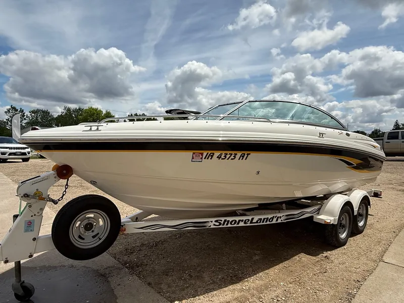 Slide: The Image of Chaparral 196 SSi 2000 boat on trailer under cloudy sky. - 2