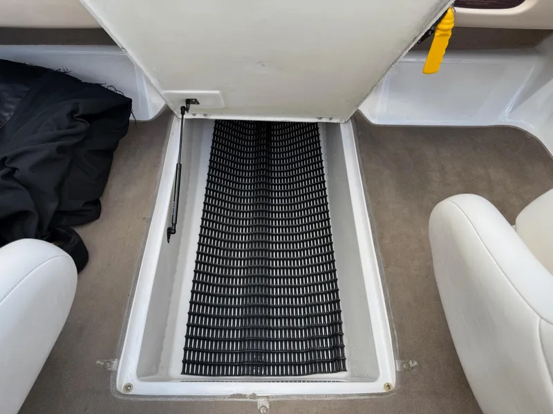Slide: The Image of Open storage compartment in 2000 Chaparral 196 SSi boat interior. - 21