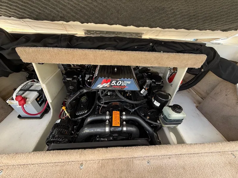 Slide: The Image of Engine compartment of a 2000 Chaparral 196 SSi boat, featuring a 5.0-liter engine. - 22