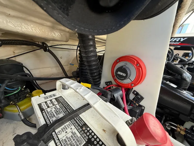 Slide: The Image of Engine compartment of a 2000 Chaparral 196 SSi boat, featuring battery and wiring. - 25