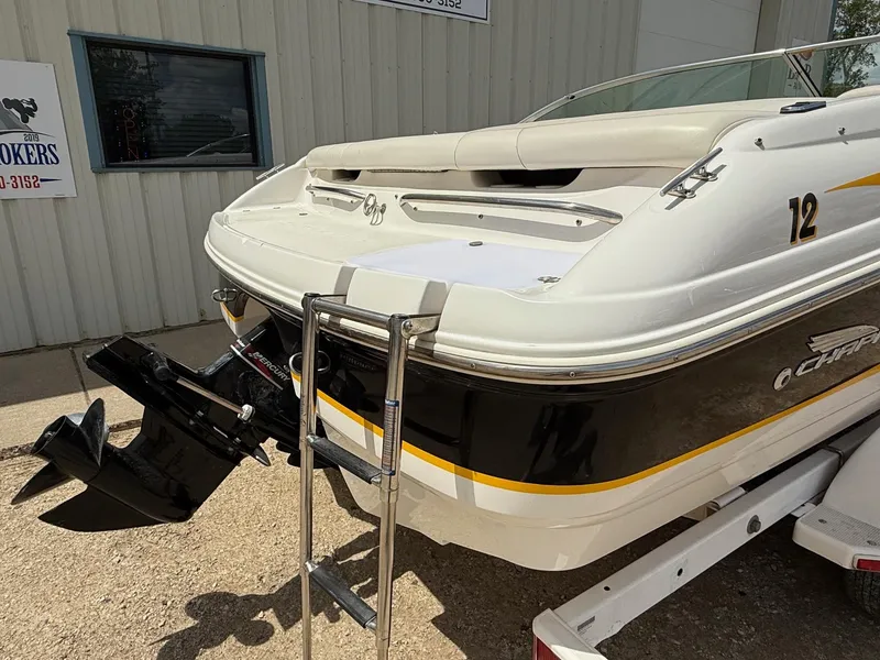 Slide: The Image of 2000 Chaparral 196 SSi boat rear view with ladder and outboard motor. - 5
