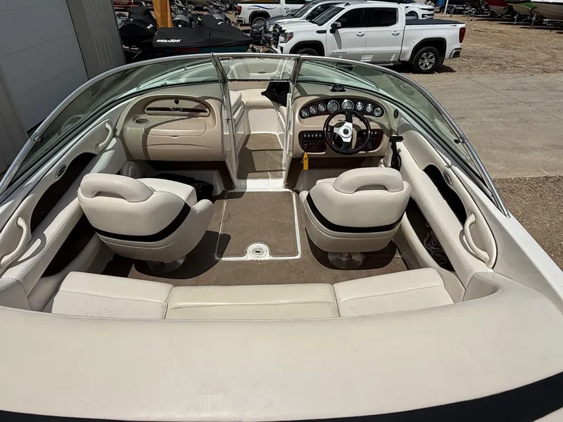 Slide: The Image of Interior of a 2000 Chaparral 196 SSi boat with beige seating and dashboard. - 6