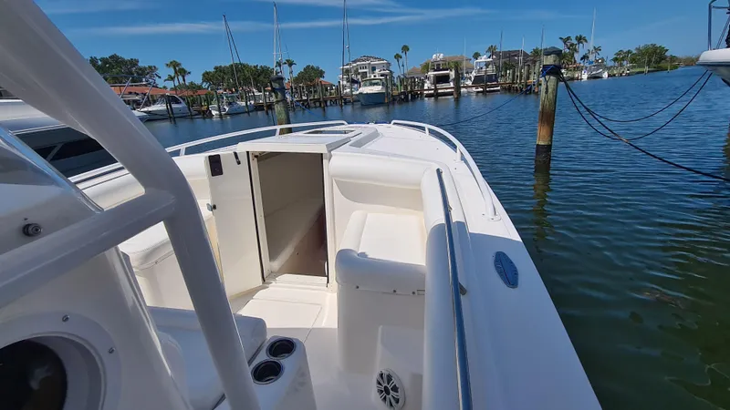Slide: The Image of 2005 Marlago FS35 boat docked in a serene marina setting. - 10