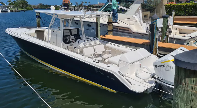 Slide: The Image of 2005 Marlago FS35 boat docked in a marina, featuring a sleek design and powerful engine. - 3