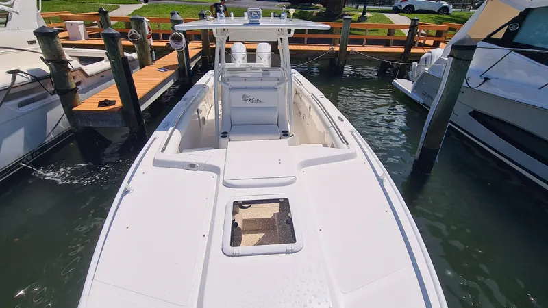 Slide: The Image of 2005 Marlago FS35 boat docked in marina, top view. - 8