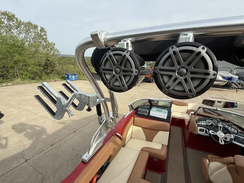 Slide: The Image of 2016 MasterCraft X23 boat interior with speakers and wakeboard rack. - 12