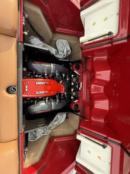 Slide: The Image of 2016 MasterCraft X23 engine compartment with Ilmor engine, red and tan interior. - 22