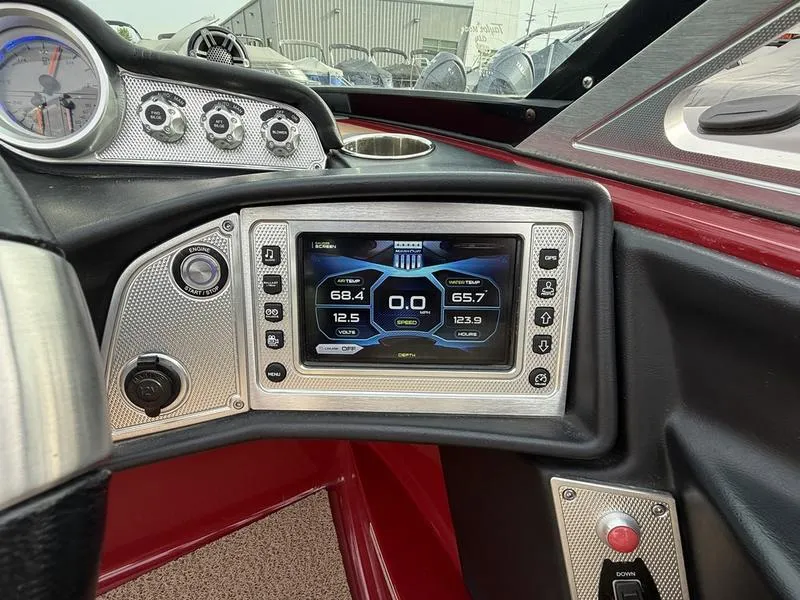 Slide: The Image of 2016 MasterCraft X23 dashboard with digital display and control panel. - 4