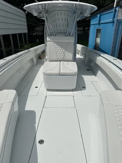 Slide: The Image of 2024 Contender 39 ST boat interior with white seating and sleek design. - 16