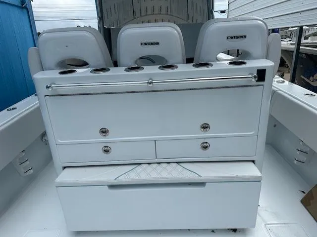 Slide: The Image of 2024 Contender 39 ST boat interior with seating and storage compartments. - 5