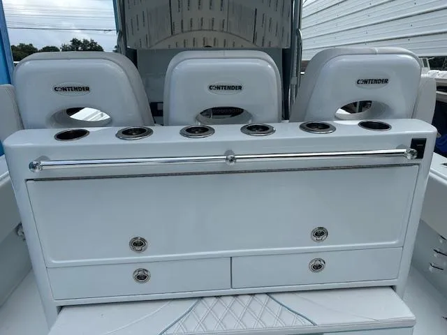 Slide: The Image of 2024 Contender 39 ST boat interior with seating and storage compartments. - 7