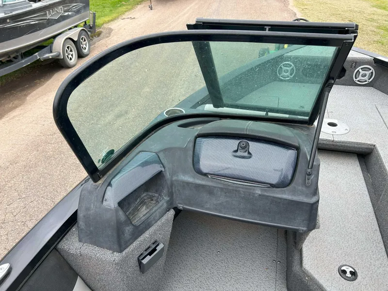Slide: The Image of 2022 Lowe Fish & Ski 19 boat interior with windshield and storage compartments. - 10