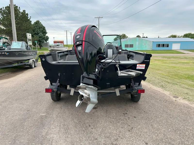 Slide: The Image of 2022 Lowe Fish & Ski 19 boat with outboard motor on a trailer. - 3