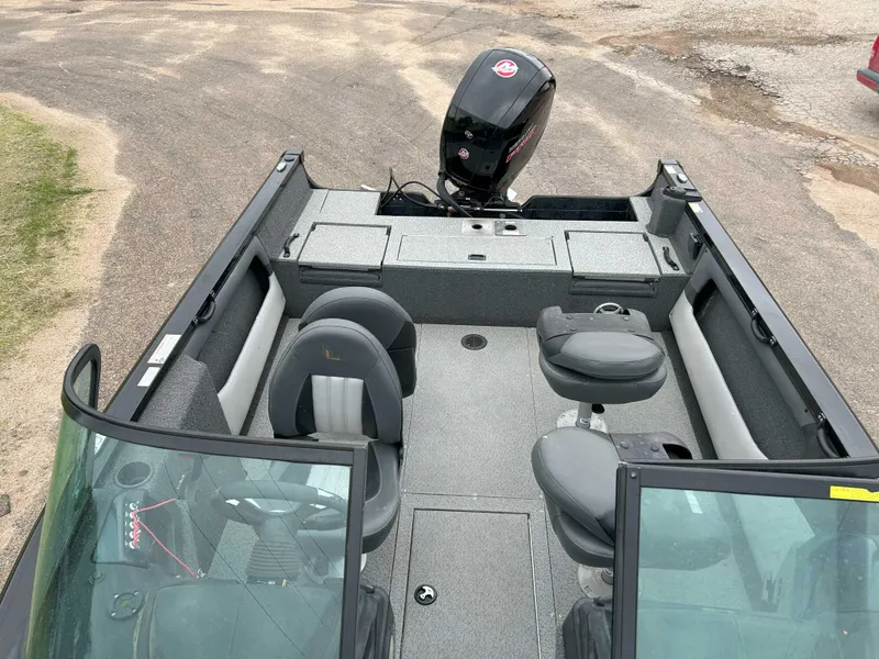 Slide: The Image of 2022 Lowe Fish & Ski 19 boat interior with seating and motor, viewed from above. - 6