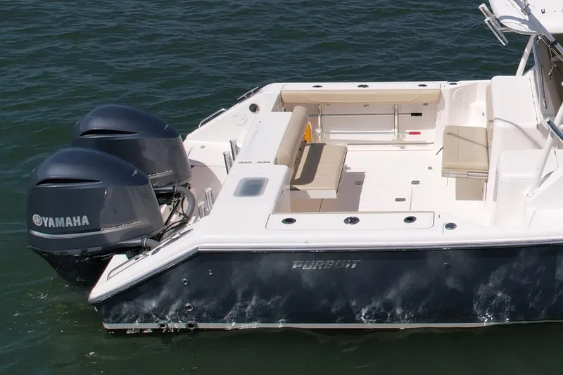Slide: The Image of 2015 Pursuit 345 Offshore boat with twin Yamaha engines on water. - 10
