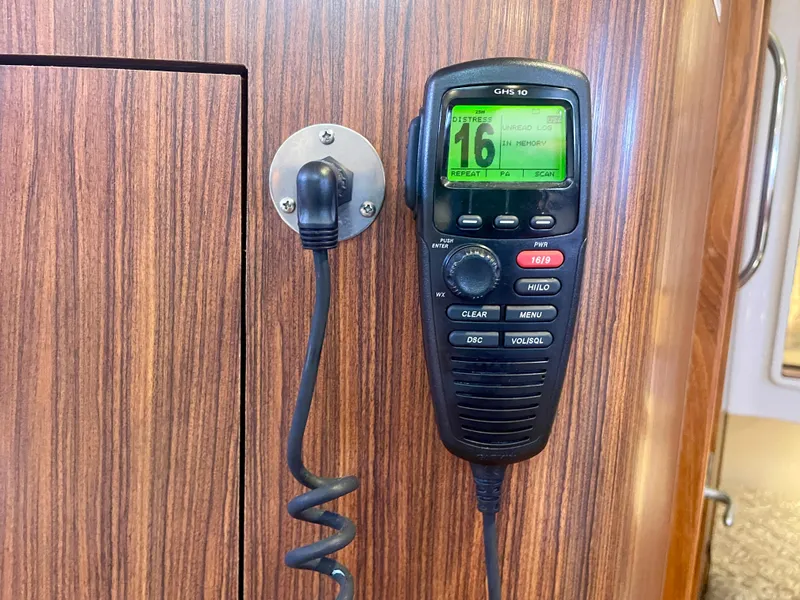 Slide: The Image of VHF radio mounted on wood panel in 2015 Pursuit 345 Offshore boat. - 28