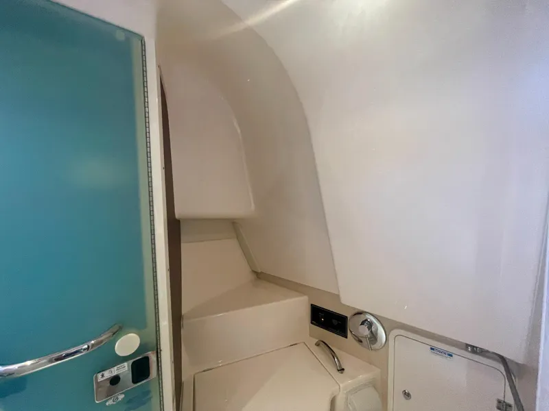 Slide: The Image of Interior cabin of 2015 Pursuit 345 Offshore boat, featuring sleek design and modern amenities. - 32