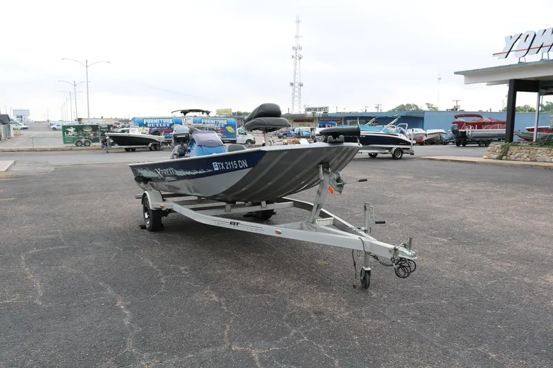 Slide: The Image of 2016 Xpress XP7 boat on trailer in parking lot. - 1