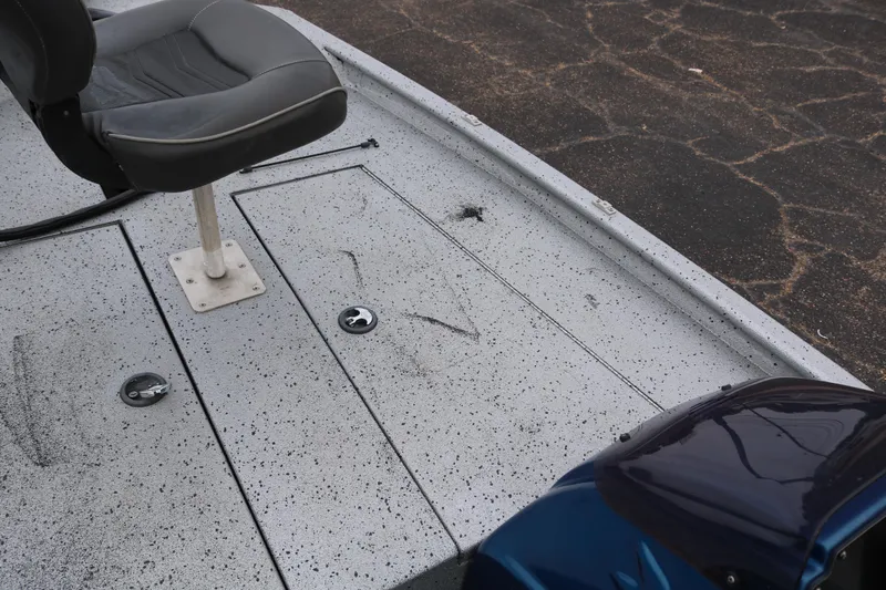 Slide: The Image of 2016 Xpress XP7 boat deck with seat and storage compartments. - 14