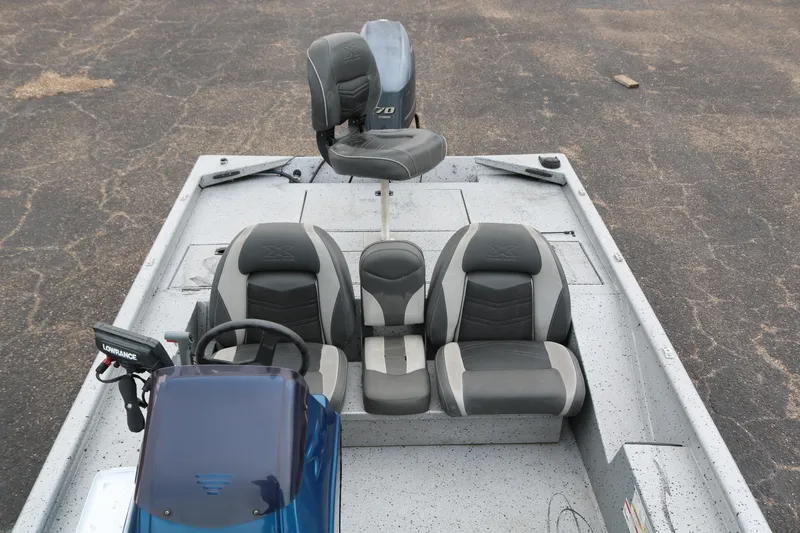 Slide: The Image of 2016 Xpress XP7 boat interior with seating and steering console. - 16