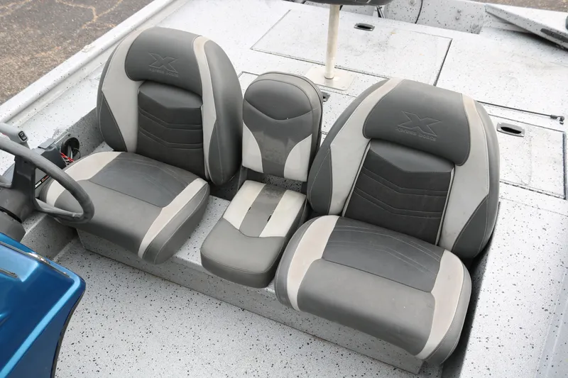 Slide: The Image of 2016 Xpress XP7 boat seats, gray and white upholstery, three-seat configuration. - 17