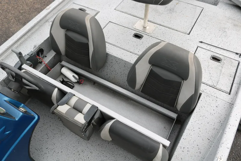 Slide: The Image of 2016 Xpress XP7 boat interior with gray seating and storage compartments. - 18