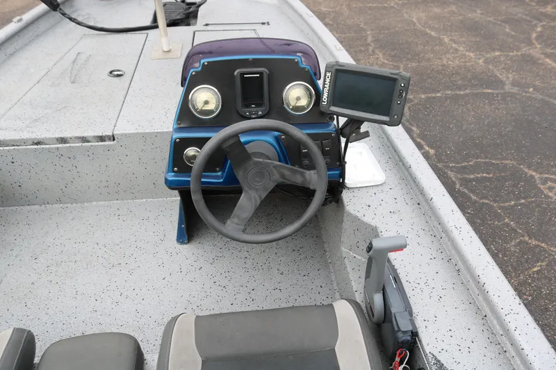 Slide: The Image of 2016 Xpress XP7 boat dashboard with steering wheel and navigation system. - 19