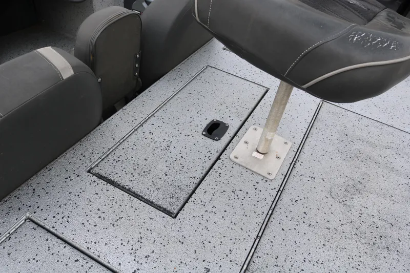 Slide: The Image of 2016 Xpress XP7 boat interior with speckled flooring and seating. - 23