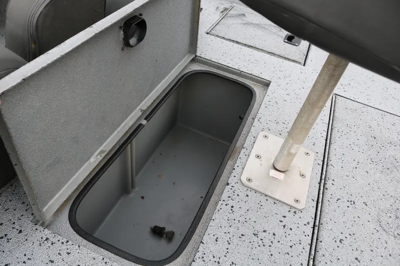 Slide: The Image of Open storage compartment on 2016 Xpress XP7 boat deck. - 24