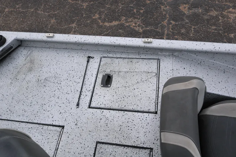 Slide: The Image of 2016 Xpress XP7 boat deck with storage compartment and seating. - 25