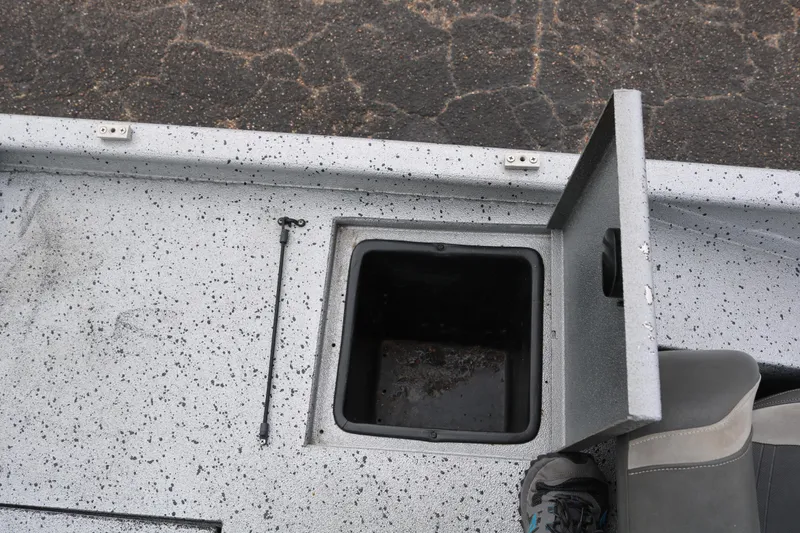 Slide: The Image of Open storage compartment on 2016 Xpress XP7 boat deck. - 26