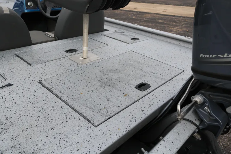 Slide: The Image of 2016 Xpress XP7 boat deck with storage compartments and motor detail. - 27