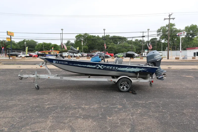 Slide: The Image of 2016 Xpress XP7 boat on trailer in parking lot, side view. - 3