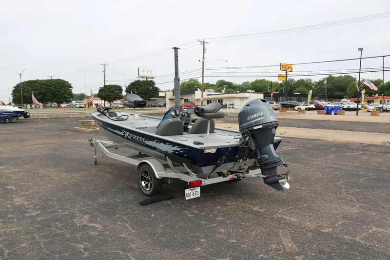 Slide: The Image of 2016 Xpress XP7 boat with Yamaha motor on trailer in parking lot. - 4