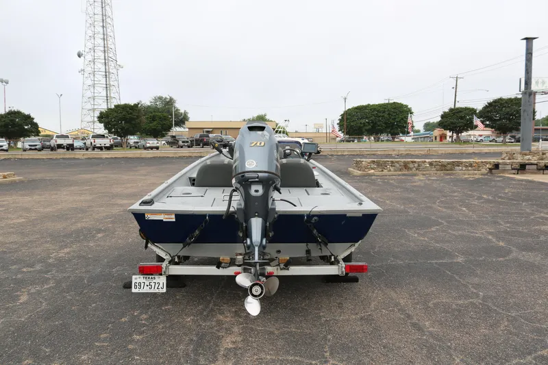 Slide: The Image of 2016 Xpress XP7 boat on trailer in parking lot, rear view. - 5