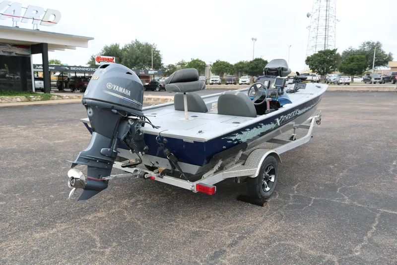 Slide: The Image of 2016 Xpress XP7 boat with Yamaha outboard motor on trailer. - 6