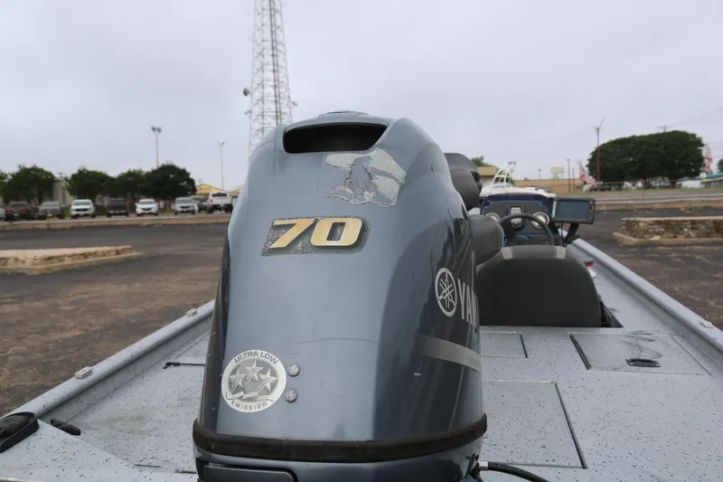 Slide: The Image of 2016 Xpress XP7 boat with Yamaha 70 engine in a parking lot. - 7