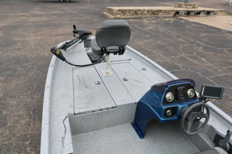 Slide: The Image of 2016 Xpress XP7 boat interior with steering console and seating. - 8