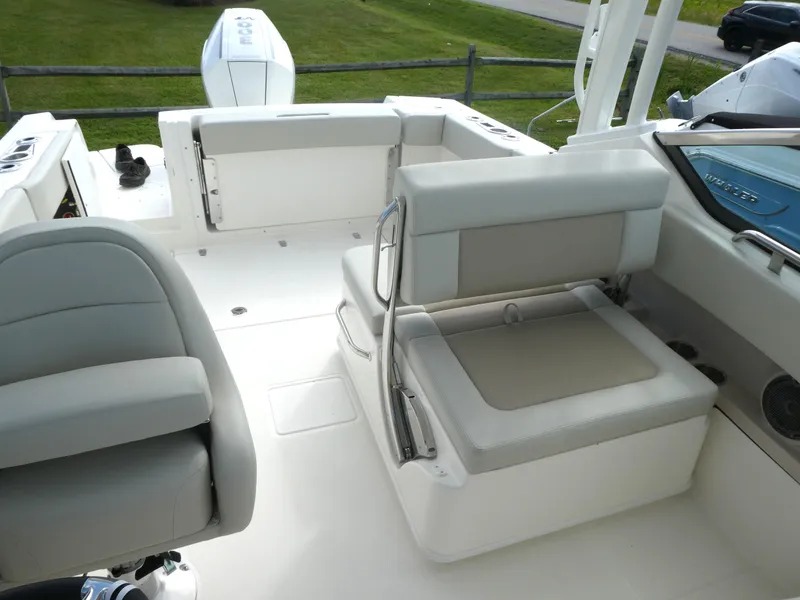 Slide: The Image of 2025 Boston Whaler 240 Vantage boat interior with seating and storage. - 10