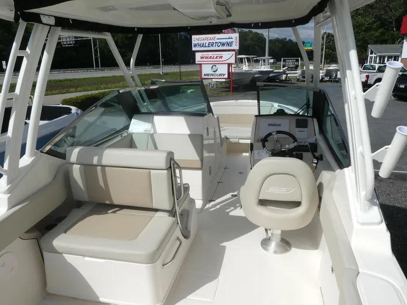 Slide: The Image of 2025 Boston Whaler 240 Vantage boat interior with seating and helm. - 4