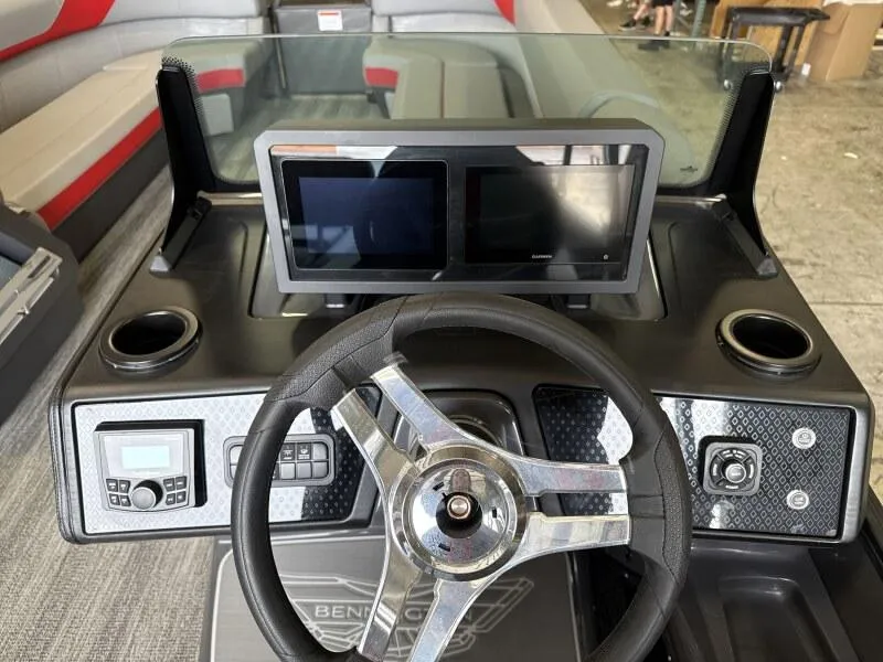 Slide: The Image of 2025 Bennington 26 MSB boat dashboard with steering wheel and dual screens. - 10