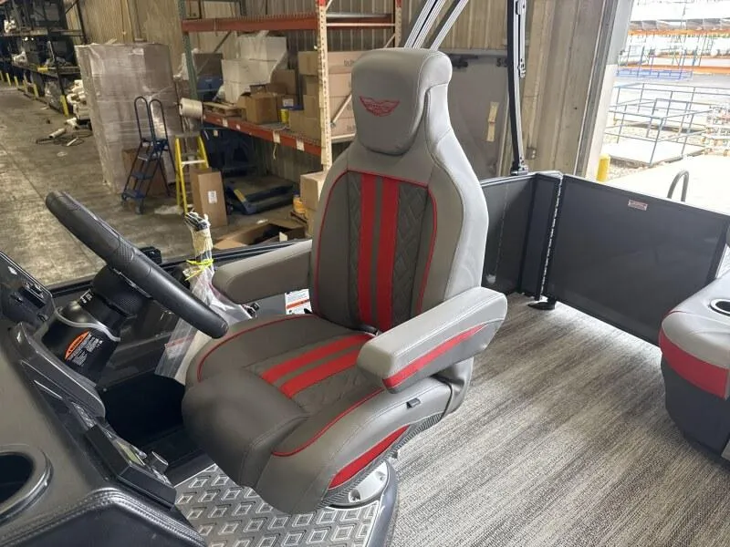 Slide: The Image of Captain's chair in 2025 Bennington 26 MSB boat, featuring gray and red upholstery. - 11