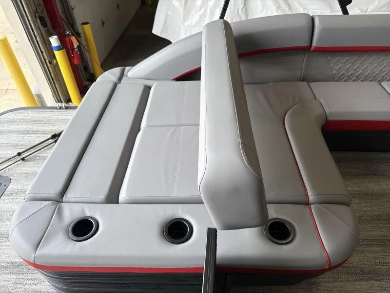 Slide: The Image of 2025 Bennington 26 MSB boat interior with gray seating and cup holders. - 13