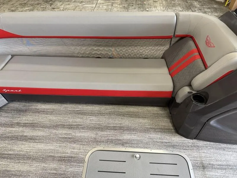 Slide: The Image of 2025 Bennington 26 MSB boat interior with gray and red seating. - 14