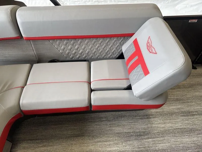 Slide: The Image of 2025 Bennington 26 MSB boat seating with gray and red upholstery, featuring quilted accents. - 9