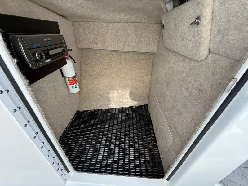 Slide: The Image of Interior of a 2009 Formula 240 Bowrider boat with stereo and fire extinguisher. - 14