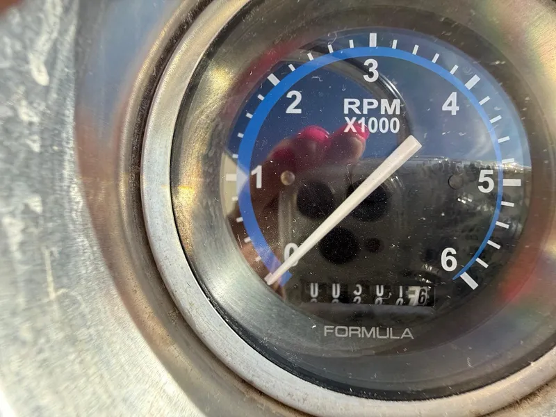 Slide: The Image of Close-up of a 2009 Formula 240 Bowrider RPM gauge showing 2,076 hours. - 18